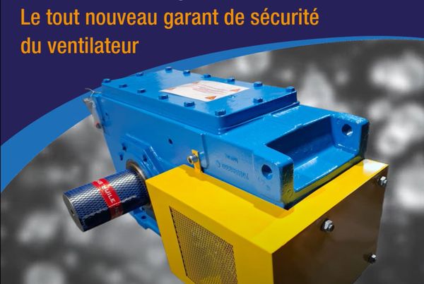 Réducteur industriel bleu équipé d'un carter de protection jaune du ventilateur, légende : garant de sécurité du ventilateur